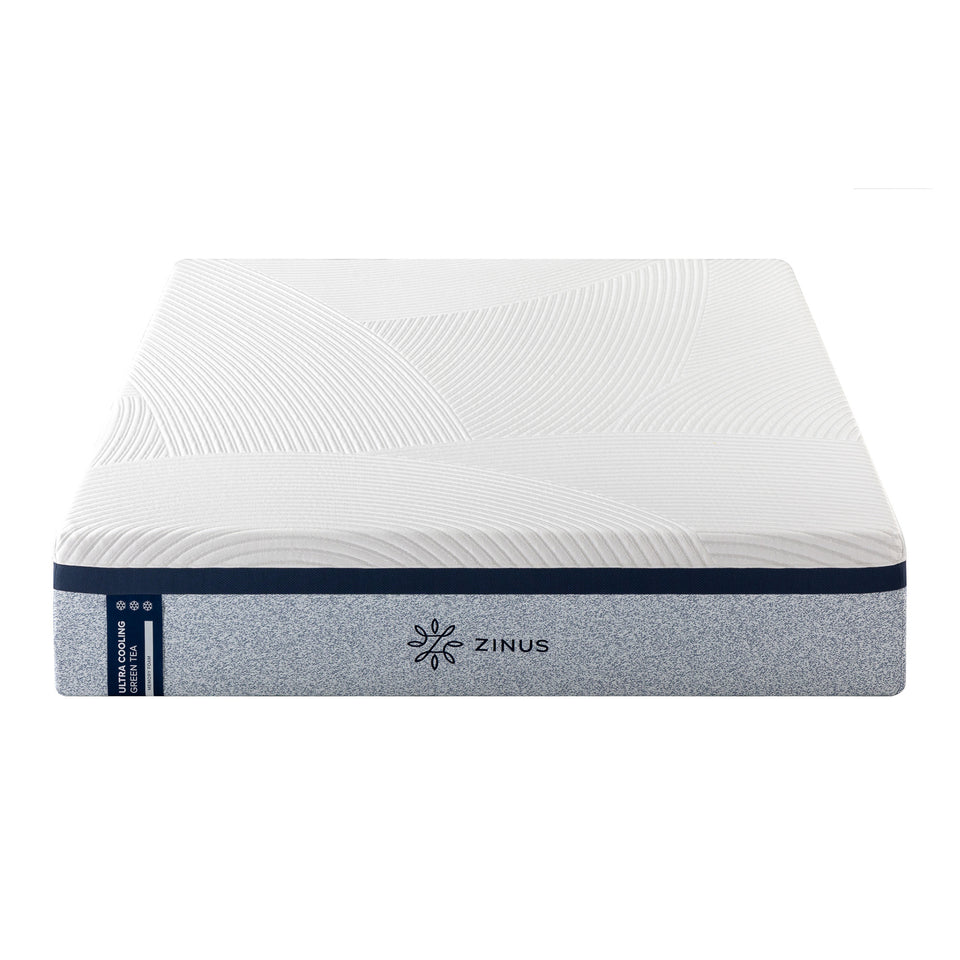 Zinus Balanced Comfort Luxe Memory Foam Mattress shown in front silo view against a plain white background, featuring a quilted wave-pattern top cover with navy trim and light blue woven side panel with Zinus brand tag, showcasing clean edges and uniform thickness.