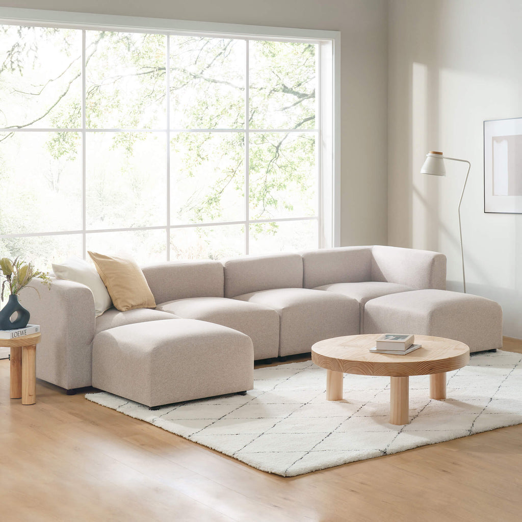 Zinus Luca Double Chaise Sectional Sofa styled in modern living room with large window and wood accents. Ivory boucle fabric, spacious double chaise, and plush cushions create a cozy centerpiece perfect for lounging or entertaining. 