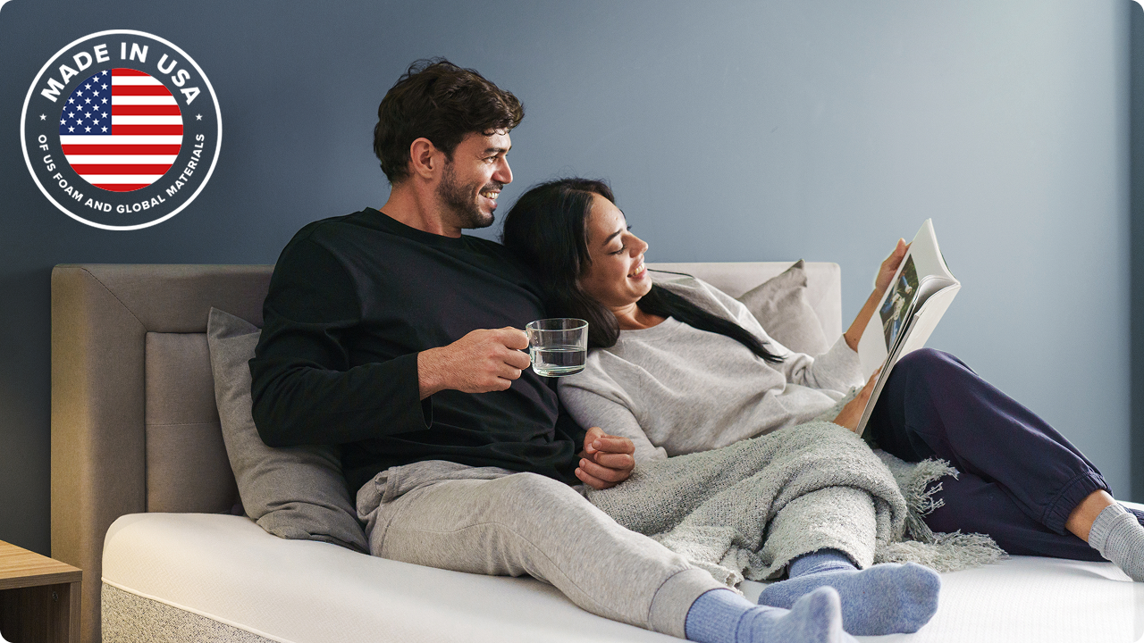 Couple lounging comfortably on a Zinus mattress proudly made in the USA with high-quality American foam and global materials—engineered for durability, comfort, and trusted craftsmanship.