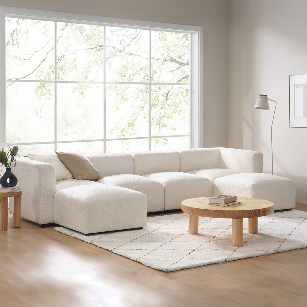 Zinus Luca Double Chaise Sectional Sofa styled in modern living room with large window and wood accents. Ivory boucle fabric, spacious double chaise, and plush cushions create a cozy centerpiece perfect for lounging or entertaining 