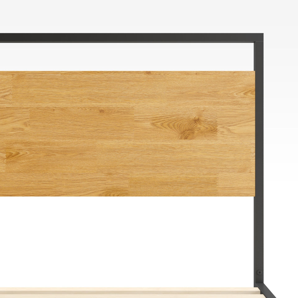 Headboard detail of Zinus Suzanne Metal and Bamboo Platform Bed Frame. Warm natural bamboo panel framed by sleek black steel creates a modern industrial look. Built with sturdy slats for reliable mattress support.