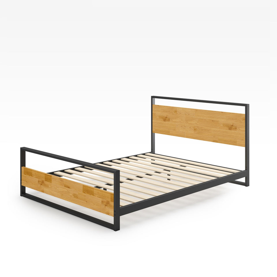 Angled view of Zinus Suzanne Metal and Bamboo Platform Bed Frame with footboard. Black steel structure paired with natural bamboo headboard and footboard. Includes wood slat mattress support for durability and no box spring needed.