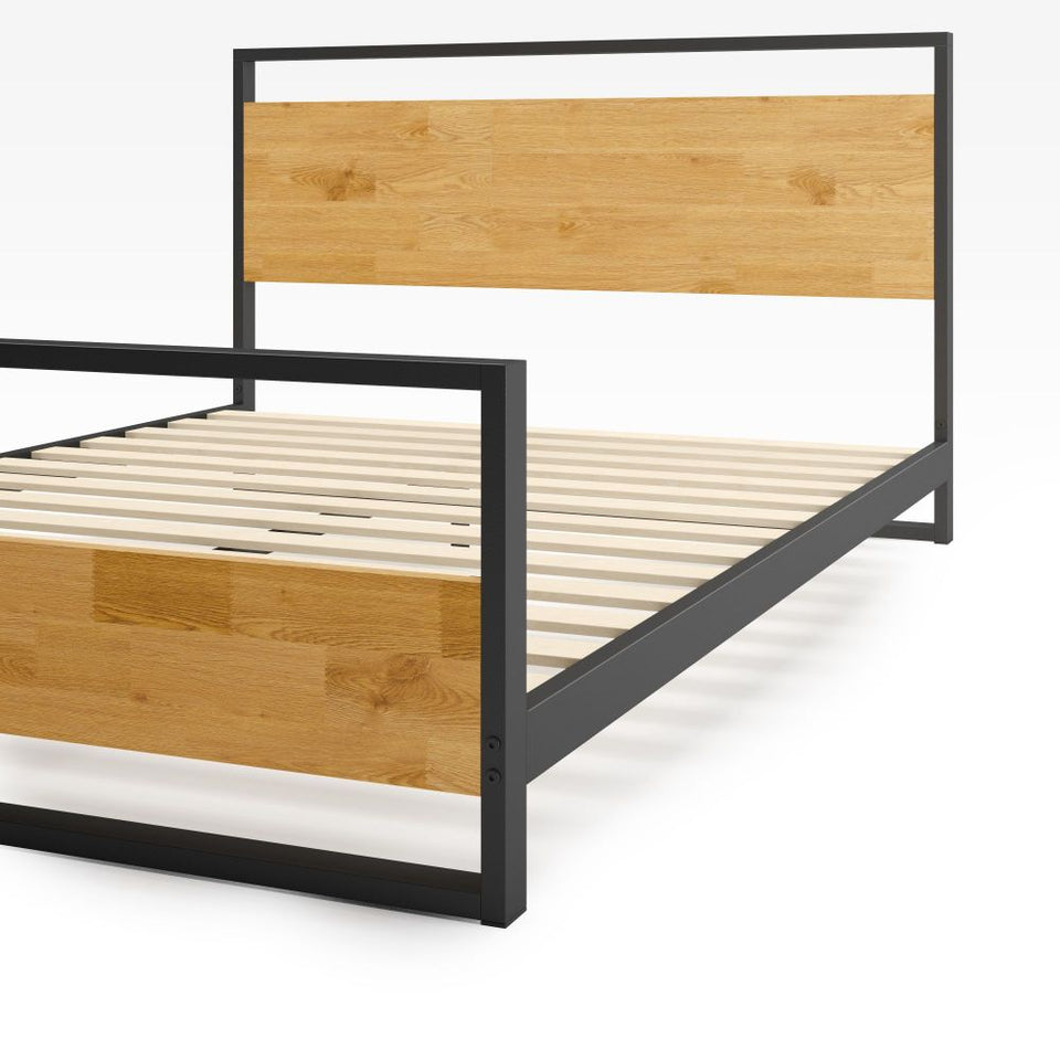 Close-up of Zinus Suzanne Metal and Bamboo Platform Bed Frame footboard and headboard. Features a sleek black steel frame with warm bamboo panels and durable wooden mattress slats for lasting support and modern industrial style.