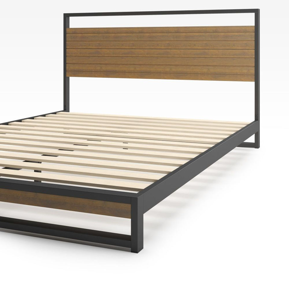 Zinus Suzanne Platform Bed Frame in bamboo and black steel, angled view showcasing durable slats and clean-lined frame. Combines natural bamboo warmth with sturdy steel structure for modern industrial appeal and reliable mattress support.