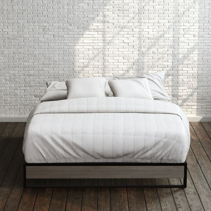 Zinus Suzanne Metal and Bamboo Platform Bed Frame in queen size, styled with white bedding against a brick wall backdrop. Black steel frame with bamboo accent panel and slatted base offers sturdy support and a clean, modern look for any bedroom.