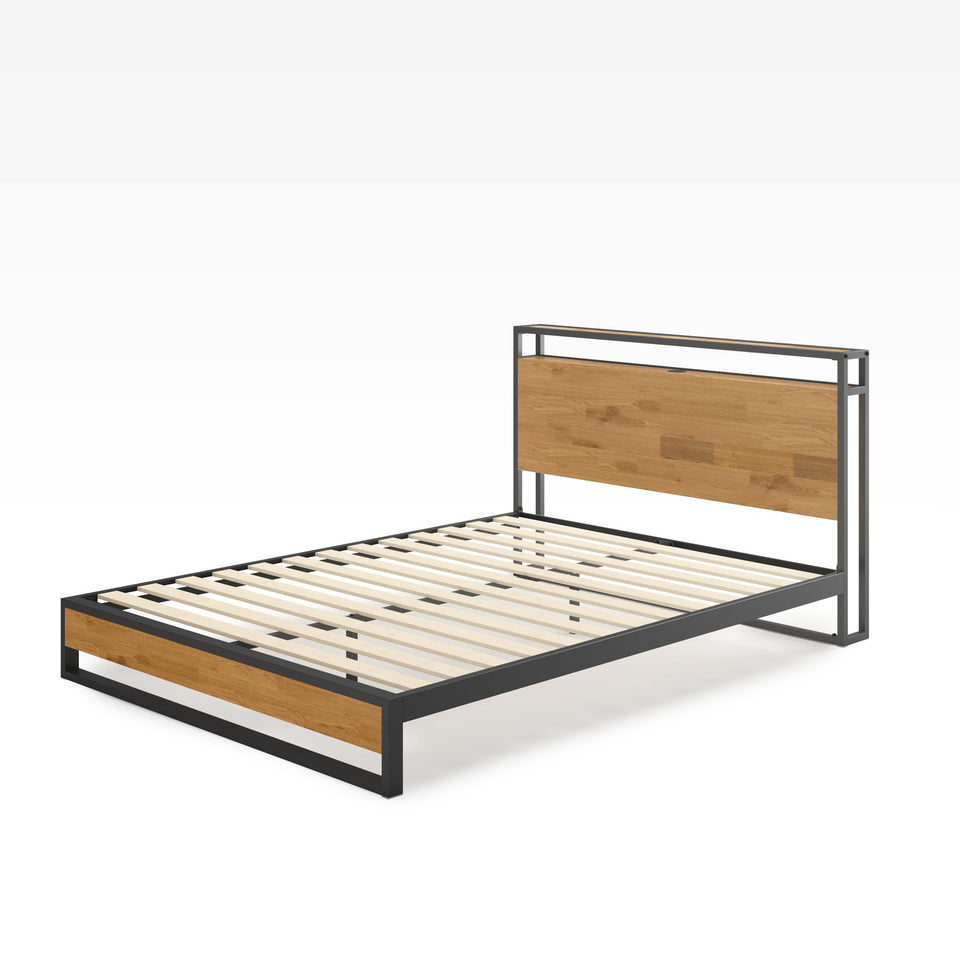 Angled view of Zinus Suzanne Metal and Bamboo Platform Bed Frame with USB port. Minimalist black steel structure with natural bamboo accents, durable wooden slats, and sleek industrial design for sturdy mattress support and modern bedroom style.