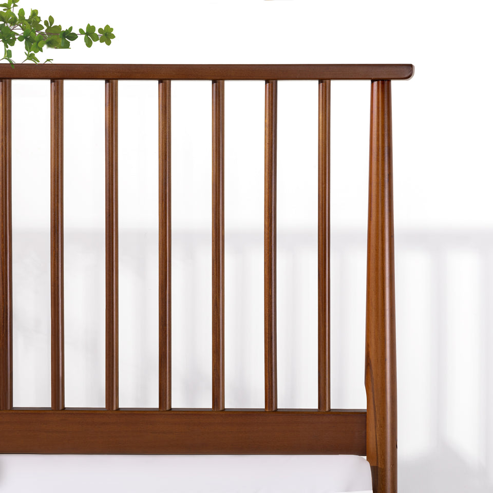 Detail of Zinus Linda Wood Platform Bed Frame slatted headboard in warm walnut finish. Evenly spaced vertical slats highlight smooth craftsmanship and mid-century inspired style. Designed for durability and stability, pairing timeless wood aesthetics with modern simplicity