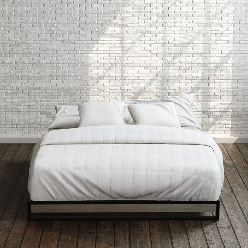 Zinus Suzanne Metal and Bamboo Platform Bed Frame in queen size, styled with white bedding against a brick wall backdrop. Black steel frame with bamboo accent panel and slatted base offers sturdy support and a clean, modern look for any bedroom.